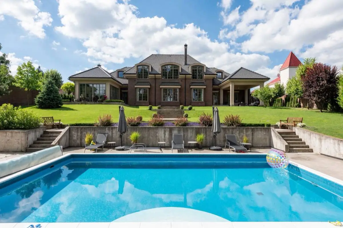 Paver pool deck around a backyard swimming pool in Stockton, CA